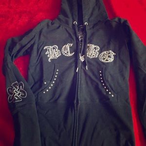 Black BCBG zip front hoodie silver design on back